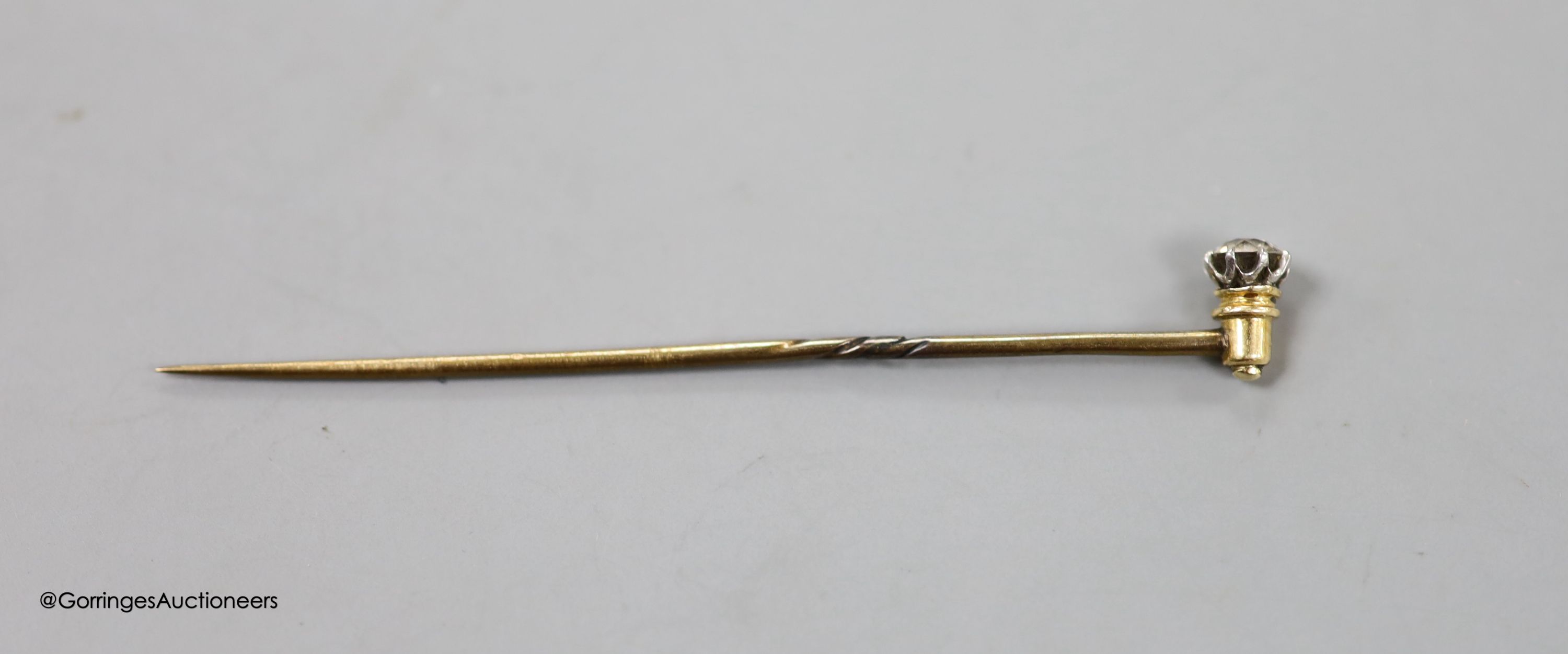 A solitaire diamond set stick pin, 63mm, gross 1.3 grams